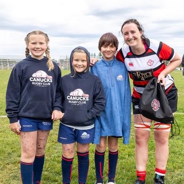 Calgary Saints women's rugby player with canucks rugby player